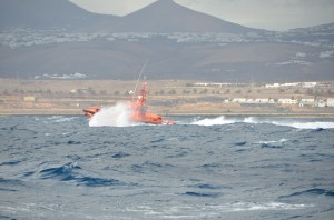 Coast Guard off to help a boat that ran ashore in big winds.